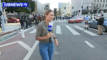 Aussie reporter caught in crossfire of violent protests