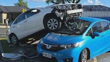 Toyota lands on top of parked car after Adelaide crash