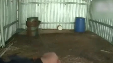 Two men found hiding in barrels after police chase
