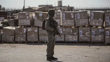 Israel says truckloads of aid waiting to enter Gaza. Why can't they bring them in?