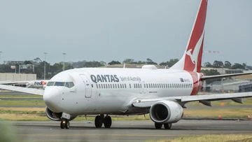 Qantas plane landed with four people out of seats after crew member broke ankle