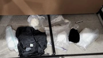 Two men to face court after Sydney raids uncover $130,000 in cash, drugs