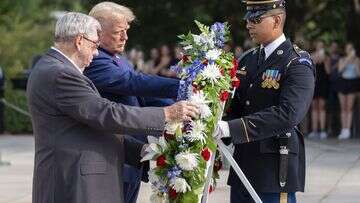 Trump staff warned about photos at veterans' cemetery, official says