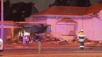 Residents forced to evacuate, driver in hospital after car smashes into home at 3am