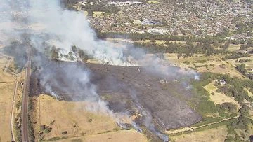 Trains stopped by grass fire in Sydney's south-west
