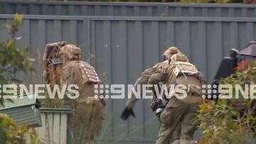 Man arrested after allegedly pointing gun at police in Melbourne