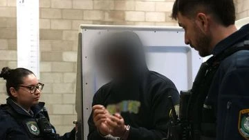 Teacher charged with grooming child, possessing abuse material