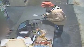 CCTV captures moment man robs store armed with meat cleaver