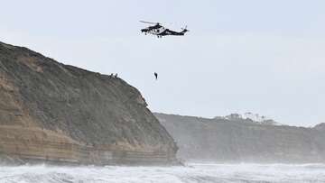 Surfer's dramatic helicopter rescue caught on camera