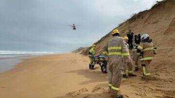 Man breaks both legs after dogs pull him down 30-metre sand dune