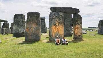 Climate protesters arrested after painting Stonehenge monument orange