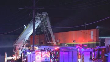 Fire rips through Melbourne business after car torched