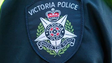 Melbourne academic charged after alleged child sex abuse images appear during lecture
