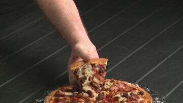 Queensland man lands coveted $100/hour pizza hand modelling gig