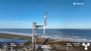 Moment mechanical arms catch huge rocket booster