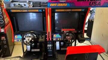 Rebels bikie charged after $400,000 found hidden in arcade game