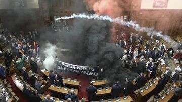 Three Serbian MPs injured as smoke bombs, flares thrown in parliament