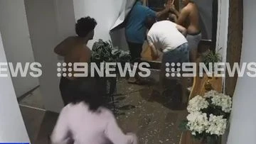 Chilling footage shows family retaliating as masked thugs try to break into home