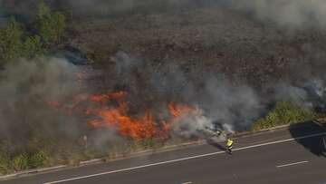 Grassfire burning at emergency level in Sydney's south west