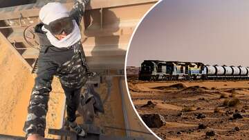 Tourists wait in the desert for hours to ride this train illegally