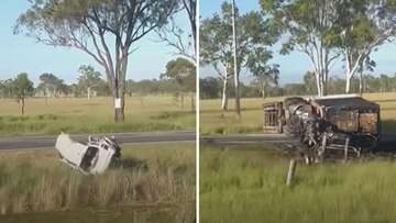 Man dies after truck and car collide on Queensland highway, sparking fire