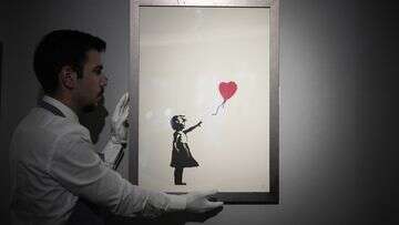 Two men charged over theft of renowned Banksy painting from London gallery