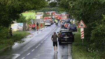 Bus torn in two after crashing into train in Slovakia