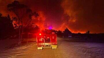 Fire crews work to contain multiple blazes ahead of 'risky and tricky' weather