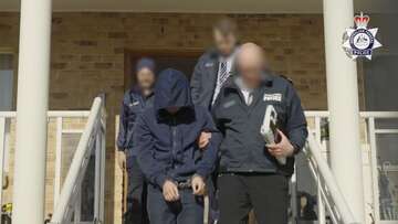 Major raids as AFP arrests alleged mastermind of secret 'Ghost' network