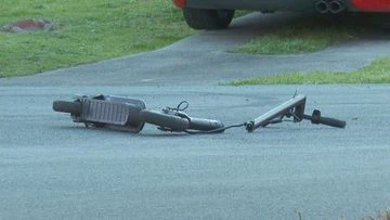 Six-year-old boy on scooter hit by car and left in the gutter