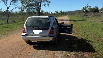 Murder charge after man's body found inside abandoned car in Queensland