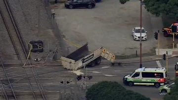 Three hospitalised, commuter chaos after truck and train collide