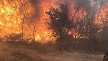 Christmas Day evacuations as bushfire continues to rage