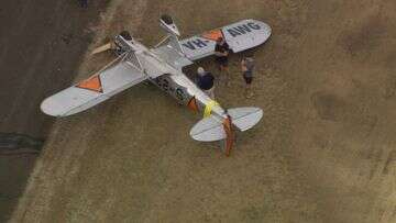 Vintage plane flips after landing, pilot taken to hospital