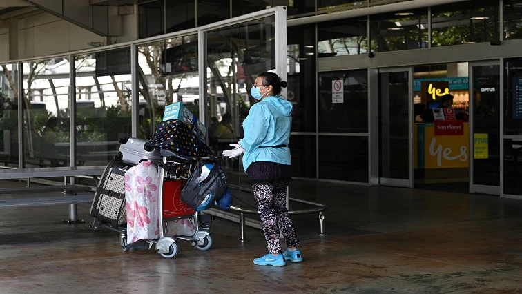Australia sticks by plan to re-open border in mid-2022