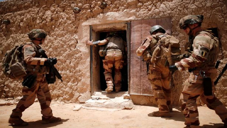 Mali says troops have regained control of village besieged by militants