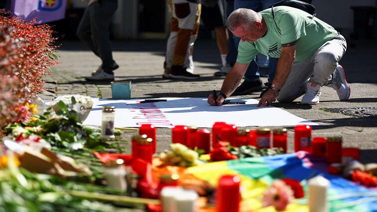 German city’s festival succumbs to grief after fatal stabbings