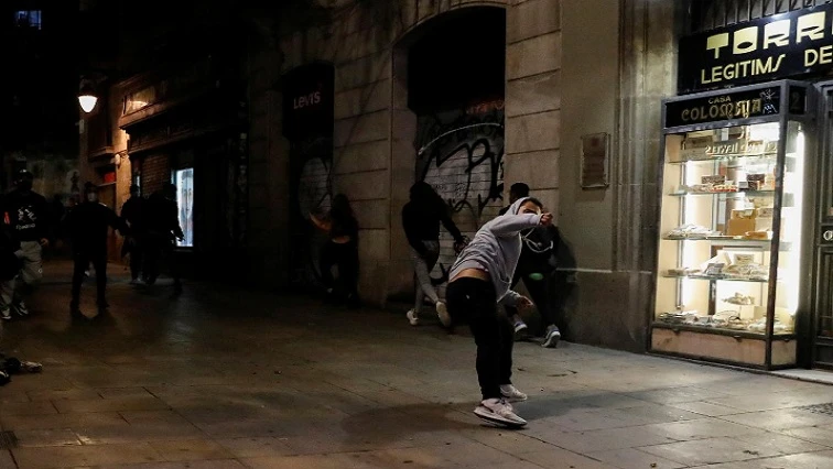 Protesters clash with police over COVID-19 restrictions in Barcelona