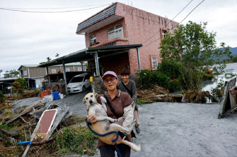 Taiwan’s rescuers search thick mud for missing people after typhoon