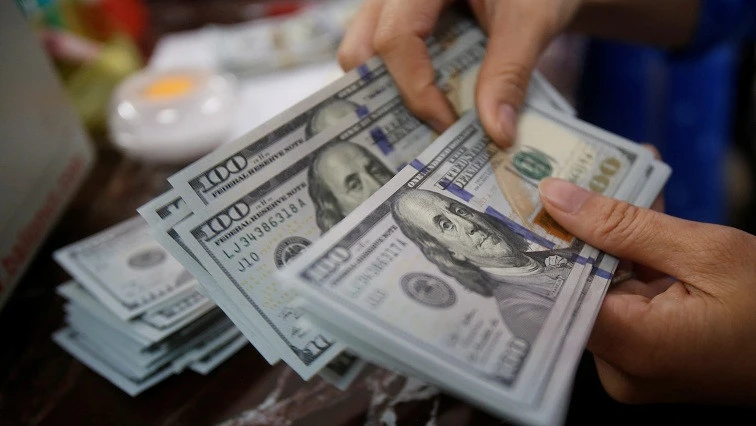 Dollar trades sideways before tax vote, Aussie holds gain before RBA