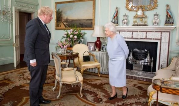 Back to work again! Beaming Queen meets Boris in person for first time in over a year