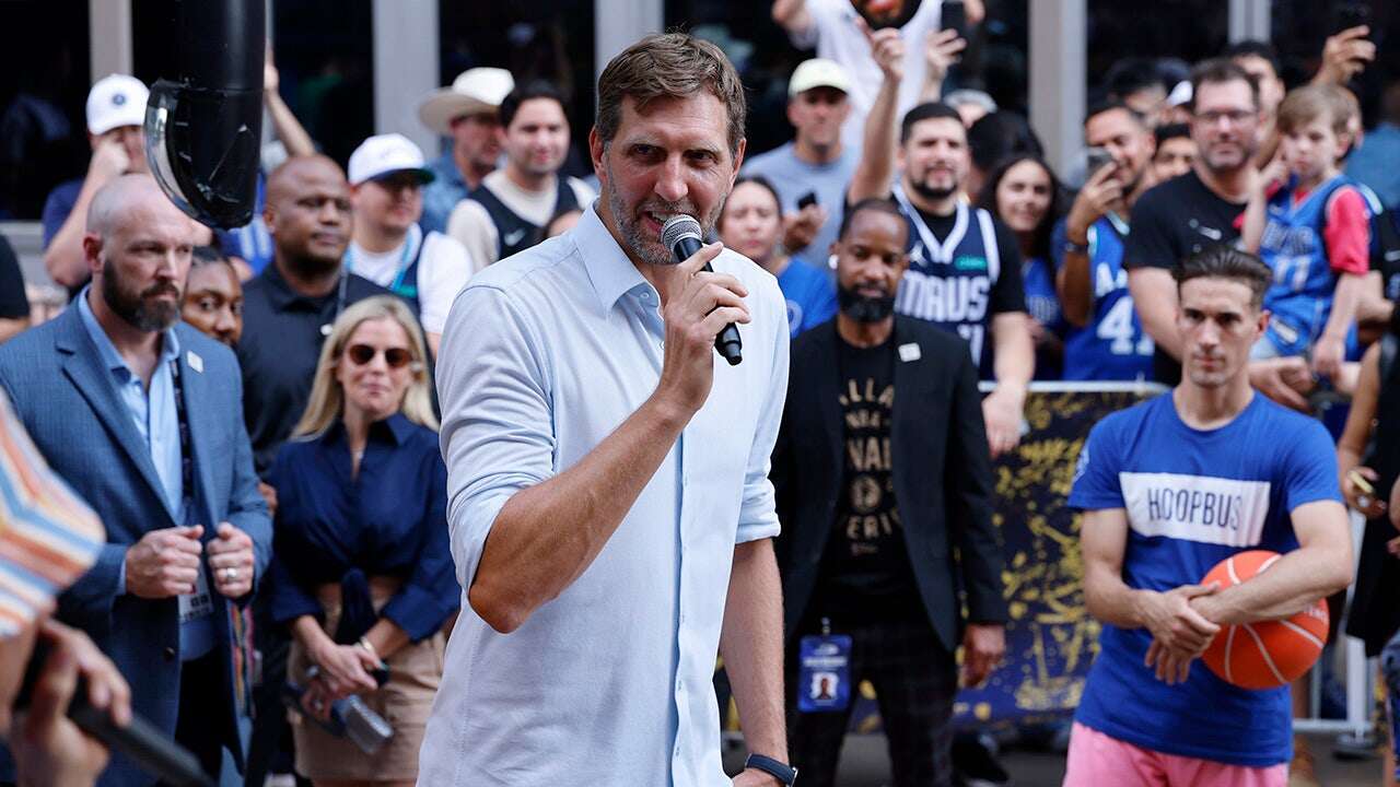 Mavericks great Dirk Nowitzki nearly knocked to the ground during fan's failed dunk attempt