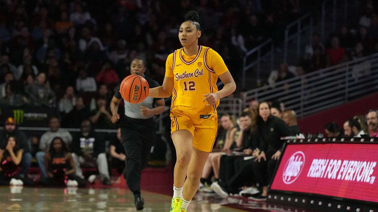 USC basketball star JuJu Watkins drains one-handed basket from behind bench ahead of record-setting night