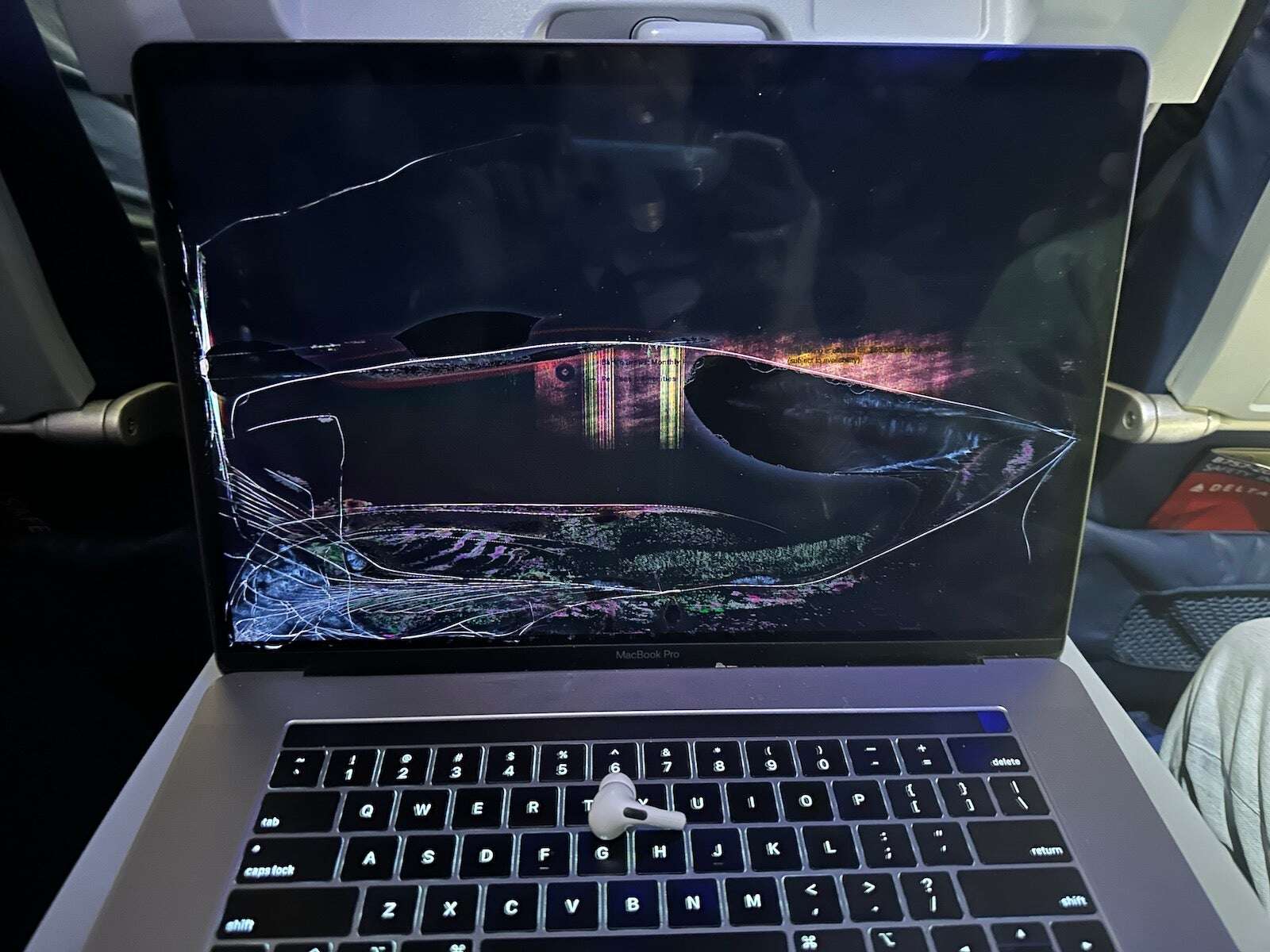 Whose fault is it when your laptop is destroyed by another passenger on a flight?