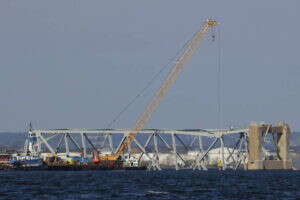 Crews prepare for removal of twisted steel from collapsed bridge