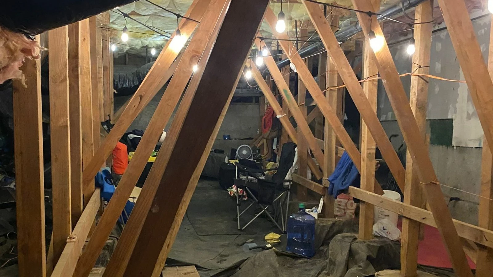 Man arrested for allegedly living in crawl space of housing complex