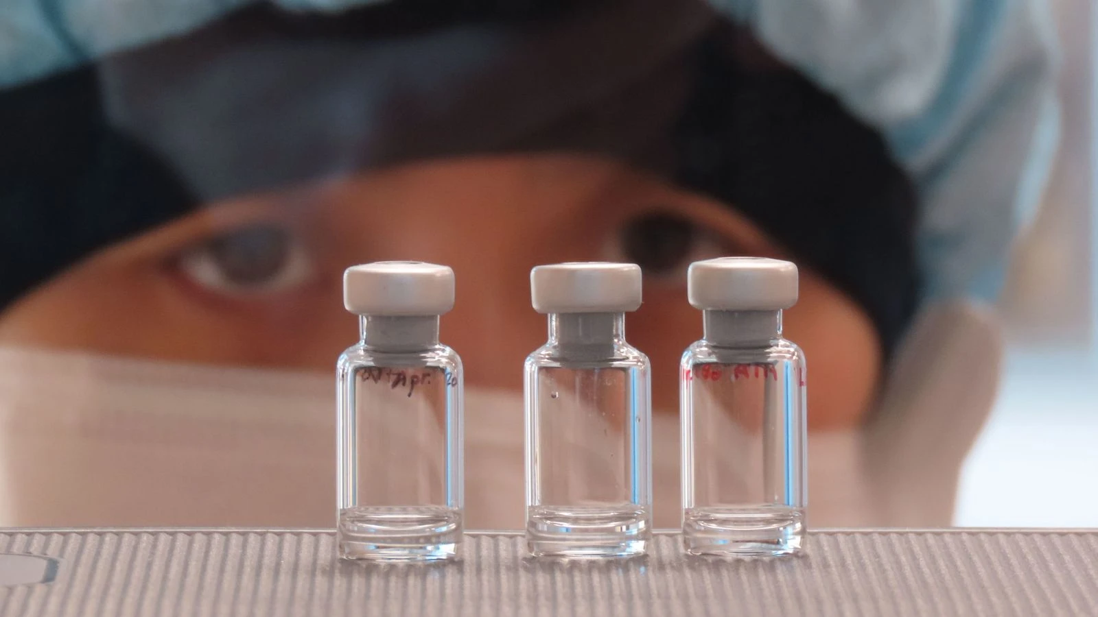 'More than one vaccine' will be available in the next three to six months, government scientist says