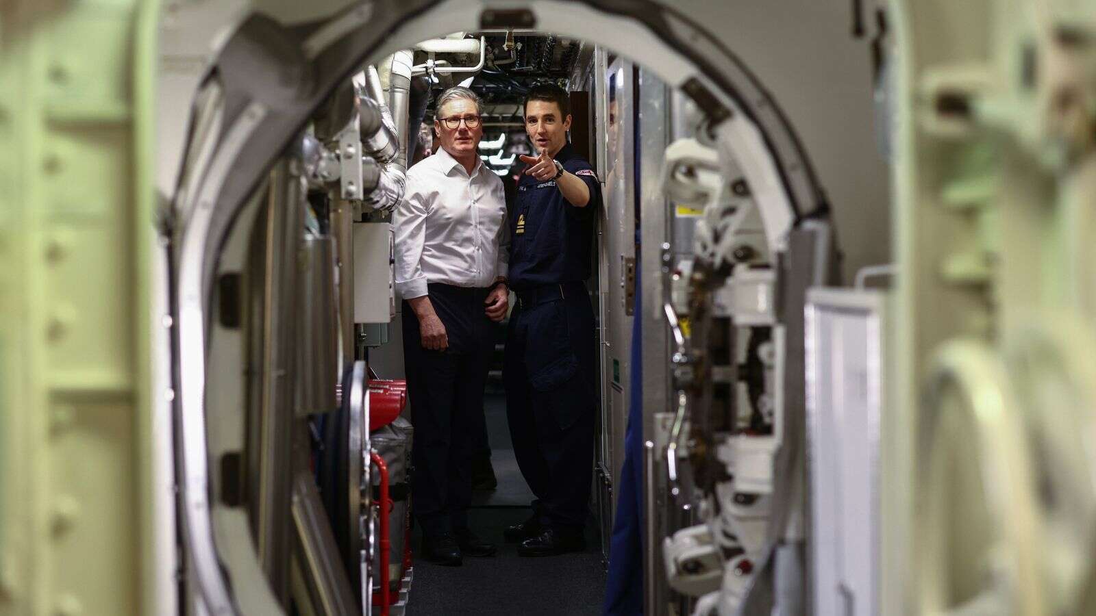 PM visits nuclear-armed submarine as tensions grow with Russia