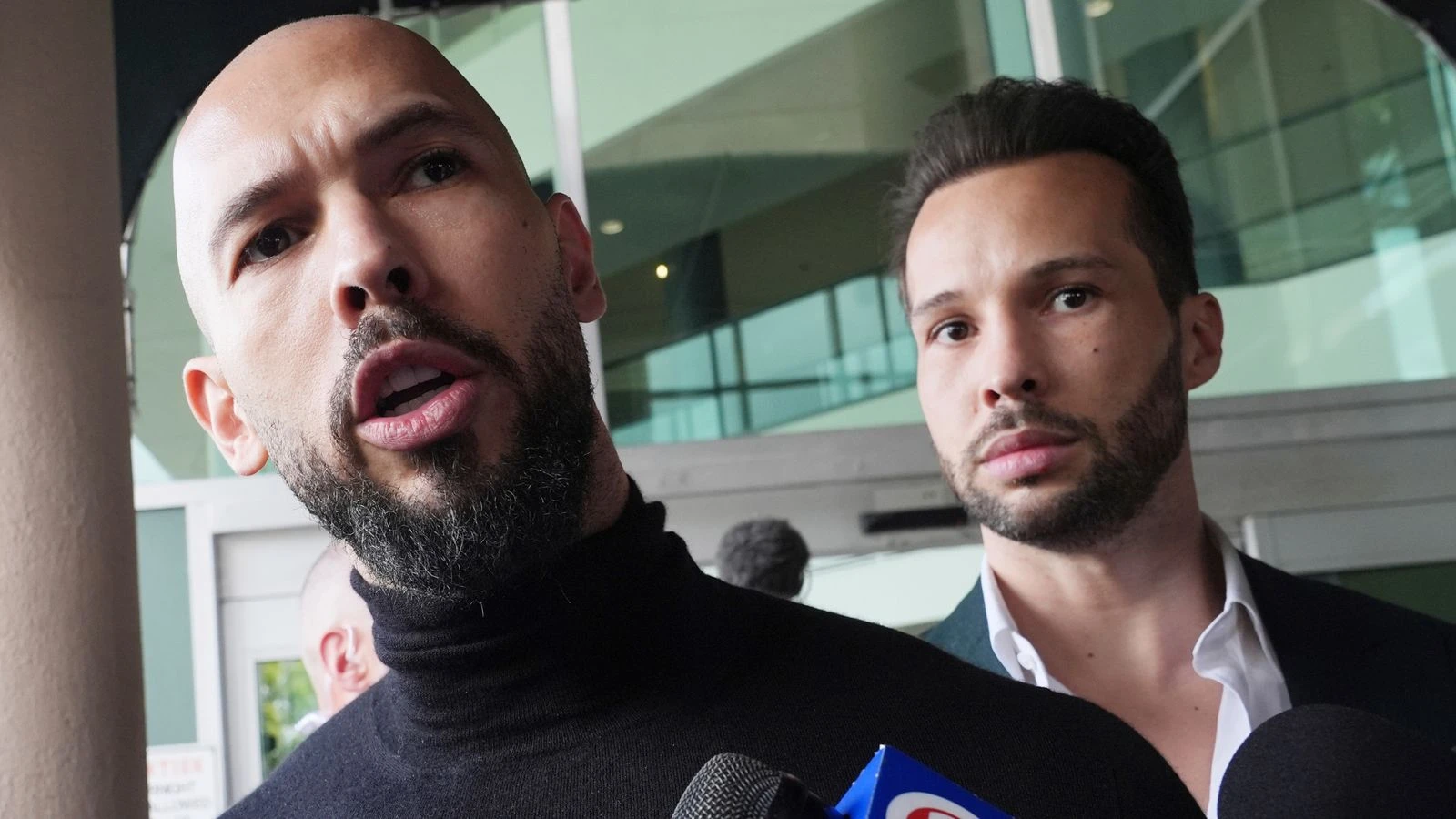 Andrew Tate and his brother Tristan 'will return to UK' to face rape charges, lawyer says