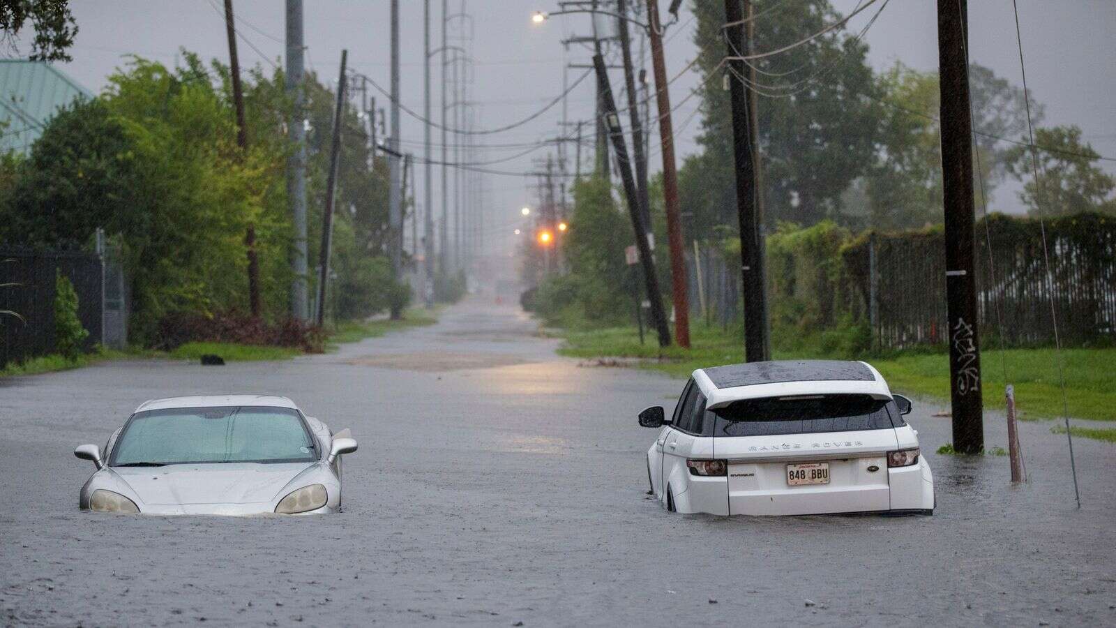 Trapped driver rescued from flood live on TV